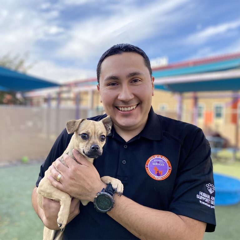 Ramon Herrera holding a dog