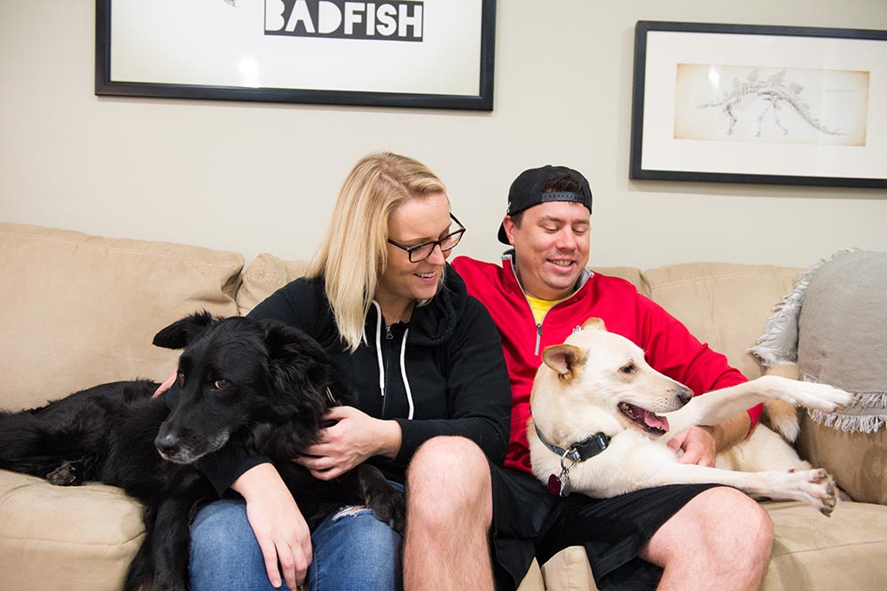 Couple with Two Dogs on Couch
